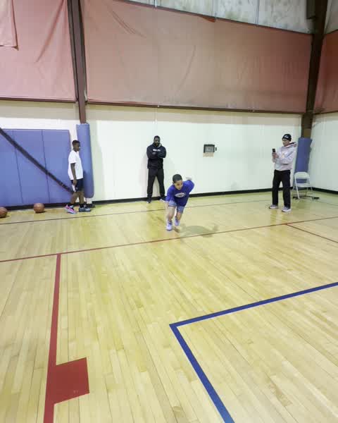 Coach and players between reps at a training session