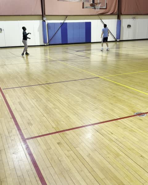 Two players working a passing and catching drill