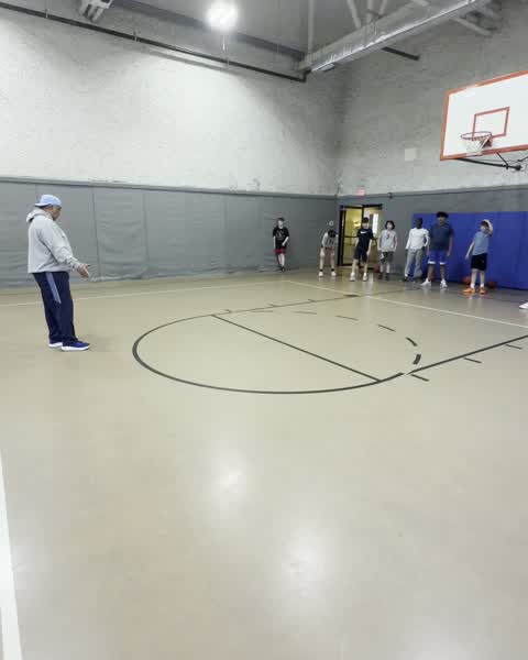 Coach and players spaced out during a session